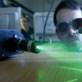 Master Student in Optics & Photonics testing a Light Microscopy Device Master Student in Optics & Photonics testing a Light Microscopy Device